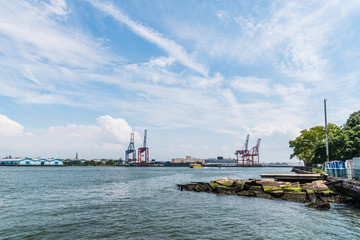 Industrial harbor with cranes on the quay