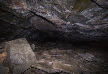 A hike through the Leidarendi lava cave in Iceland. Tunnels are very narrow.