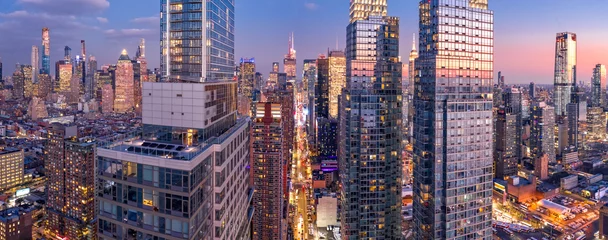 Fotobehang Aerial view of New York City skyscrapers at dusk as seen from above the 42nd street canyon © mandritoiu
