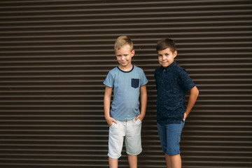 Two stylish childrend posing to the photograher. Young model