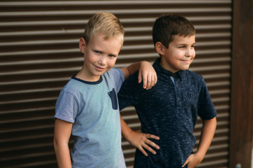 Two stylish childrend posing to the photograher. Young model