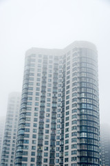 Fototapeta premium multi-storey house in the fog