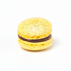 Sweet yellow macaroon isolated on white background.
