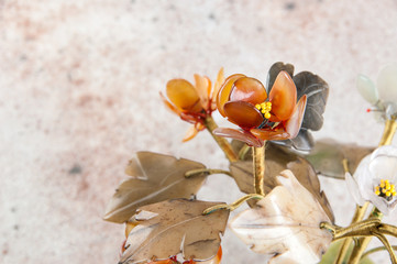 Fototapeta na wymiar Vintage glass flowers on concrete background.
