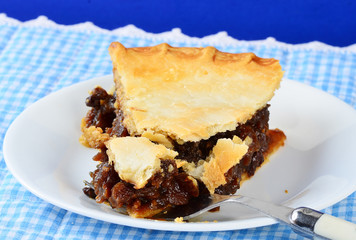 Slice of Mincemeat Pie with Bite on Fork