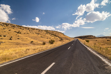 Long straight road going across countryside