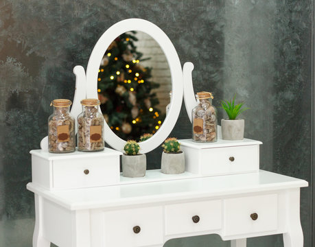 white vintage pier glass with an oval mirror