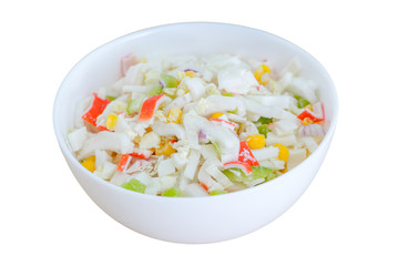 Salad with corn and crab sticks isolated on white background. Selective focus