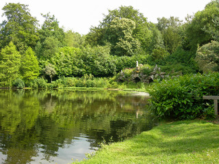 Fototapeta na wymiar lake, trees and stone fountain, England