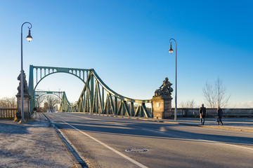Outdoor scenery on the road at the front of Glienicke Bridge, Glienicker Brücke, which connects Berlin and Potsdam cross Glienicker river in Germany during sunny day. 