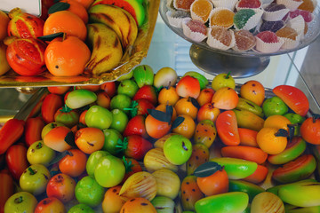 Colorful marzipan almond shaped fruit candies in an Italian pastry shop