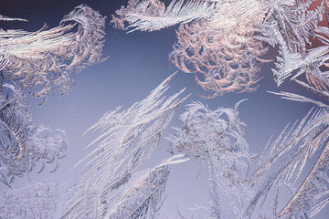 Frost and ice crystals on window glass. Winter background.