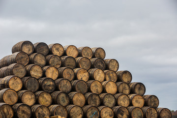 Stacked pile of old wooden barrels and casks at Speyside Cooperage in Scotland © -Marcus-
