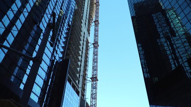 View of a construction site of a new skyscraper called Seaport Residences being built in Manhattan.