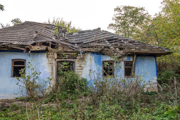Fototapeta na wymiar ODESSA, UKRAINE, 6 October 2014: Old house in Ukrainian village. Endangered agriculture, abandoned houses. Government is not engaged in problems of village. Poor depressed area