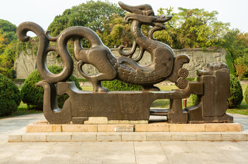 Fototapeta premium Stone sculpture of a dragon in East Lake park sculpture garden, Wuhan, China.
