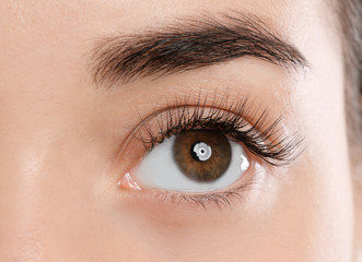 Fototapeta na wymiar Young woman with beautiful eyelashes, closeup view