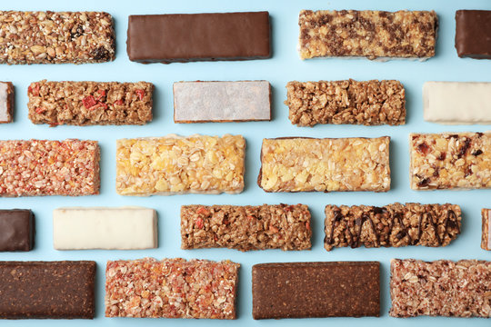 Flat Lay Composition With Protein Bars On Color Background