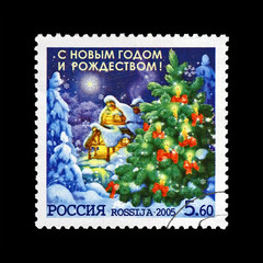 green holiday tree with gift heap, trees under snow, snowdrift, snowflake for Christmas, circa 2005. Happy New Year and Merry Christmas 2005. vintage post stamp of Russia isolated on black background.