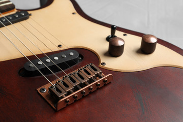Fototapeta na wymiar Modern electric guitar on color background, closeup view