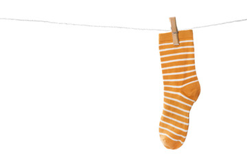 Cute child sock on laundry line against white background