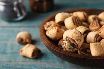 Tasty sweet cookies with poppy seeds on wooden table. Space for text