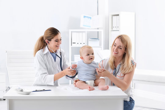 Woman with her baby visiting children's doctor in hospital