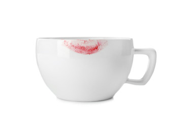Ceramic cup with lipstick mark on white background