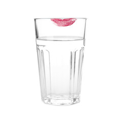 Glass of water with lipstick mark on white background