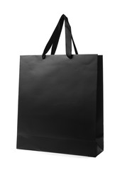 Paper shopping bag with handles on white background. Mockup for design