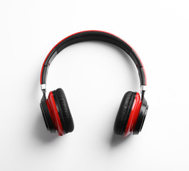 Stylish modern headphones with earmuffs on white background