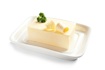 Ceramic dish with block of fresh butter on white background