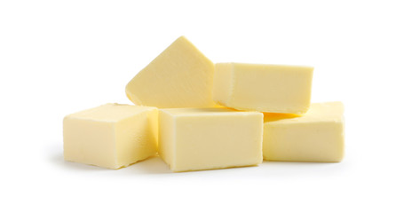 Cut butter on white background. Dairy product