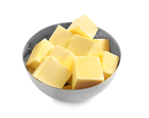 Bowl with cubes of fresh butter on white background