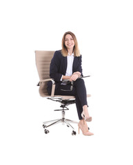 Young businesswoman with laptop sitting in office chair on white background