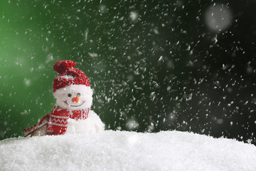 Decorative snowman on color background, space for text. Winter weather