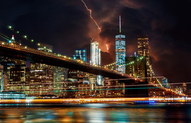 Fototapeta na wymiar Brooklyn Bridge and Dramatic sky and lightning