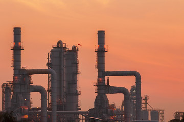 Concept Pollution and industrialization . Details of oil pipelines with valves in large oil refineries, in sunrise time refining equipment, close-up of industrial pipelines of oil refineries. Global. 