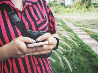 Woman using smart phone on hand