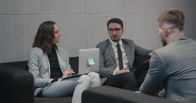 HR managers interviewing male job employee, have positive first impression of candidate, happy employers listen to applicant at interview excited of candidature. Recruitment concept. 4K UHD