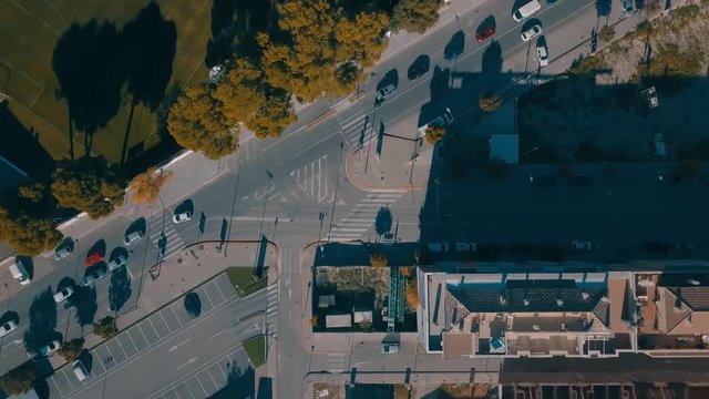Rotating Top Down Aerial View of Intersecting Roads and City Traffic
