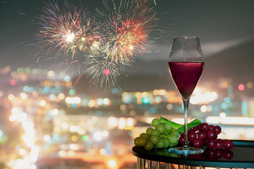 Rose wine or red wine, At night light over city background, Christmas festive celebration. End of...