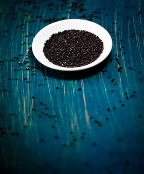 Brown Mustard Seeds background with copy space selective focus