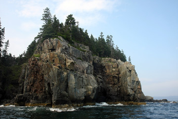Fototapeta na wymiar The rocky coast and cliffs of islands off Bar Harbor on Mount Desert Island, Maine.