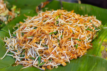Closeup cooking Pad Thai noodles, Thai street food in the market popular Thai Food Bangkok Thailand  