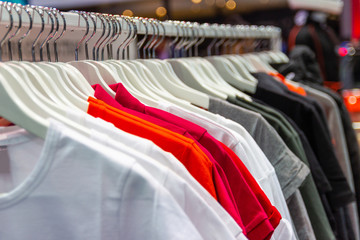 Colorful t-shirt on hangers for sale in department stores.