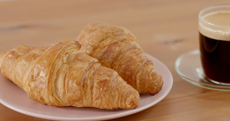 Croissant and coffee morning breakfast