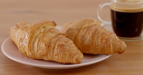 Croissant and coffee morning breakfast