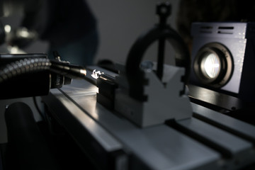 On the left is the drill under the microscope which is illuminated by LEDs. On the right is on the monitor displayed output of the microscope.