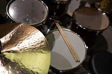 Closeup of drumsticks lying on the professional drum set. Drummer equipment. 